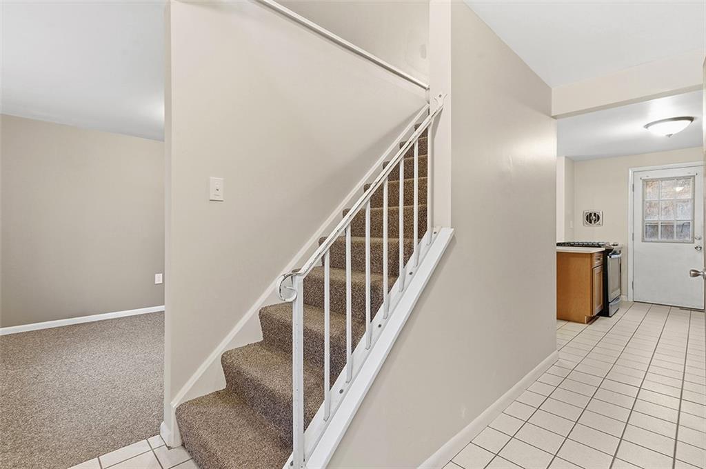924 Old Hills Road McKeesport, PA 15135 - Photo 6 of 20 a view of a hallway with wooden floor and staircase