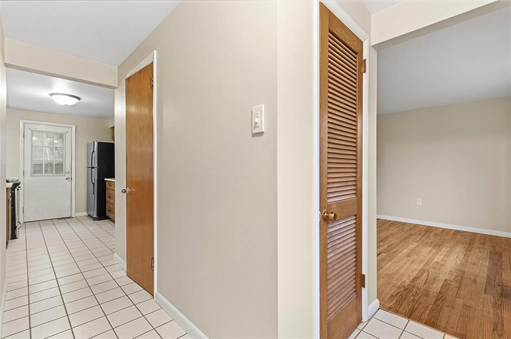 924 Old Hills Road McKeesport, PA 15135 - Photo 7 of 20 a view of a hallway with wooden floor and staircase