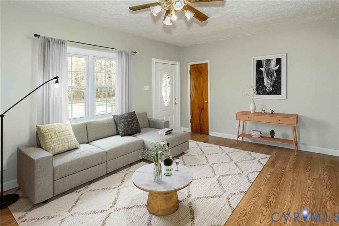 11512 Duncan Road Petersburg, VA 23805 - Photo 3 of 19 a living room with furniture and a chandelier