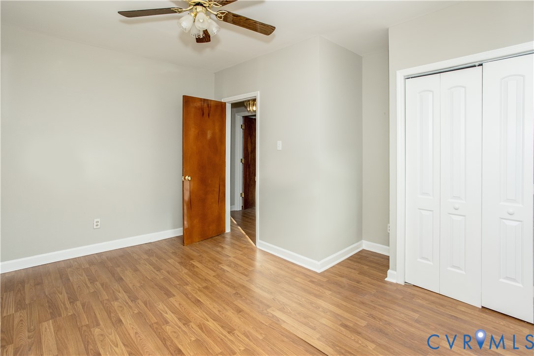 11512 Duncan Road Petersburg, VA 23805 - Photo 6 of 19 a view of an empty room with wooden floor