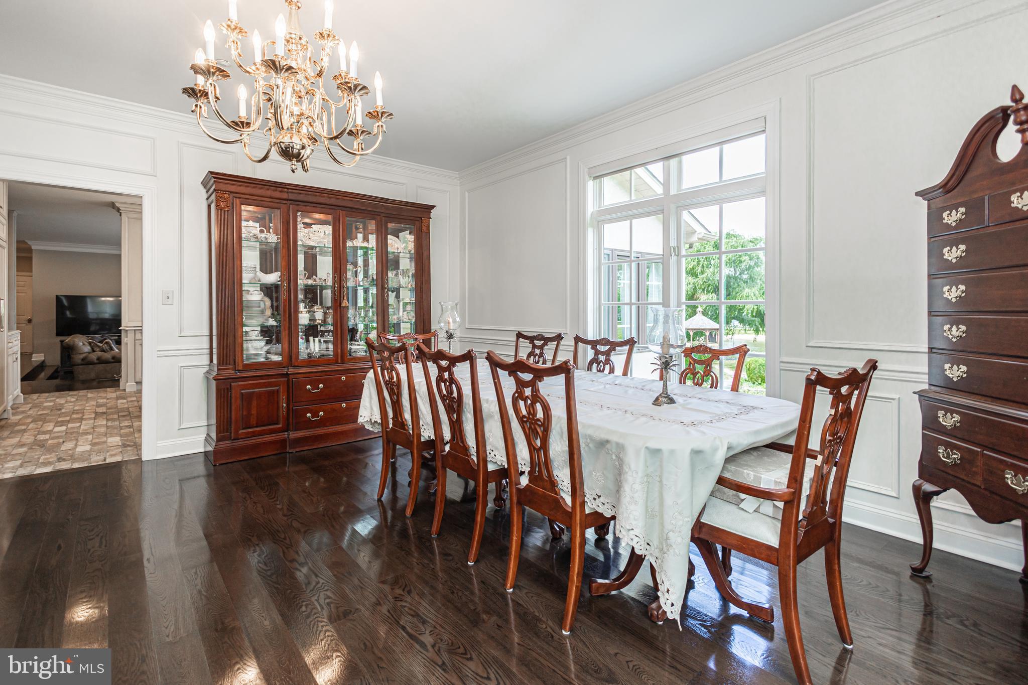 3380 Indian Springs Road Doylestown, PA 18902 - Photo 15 of 57 a view of a dining room with furniture wooden floor and chandelier