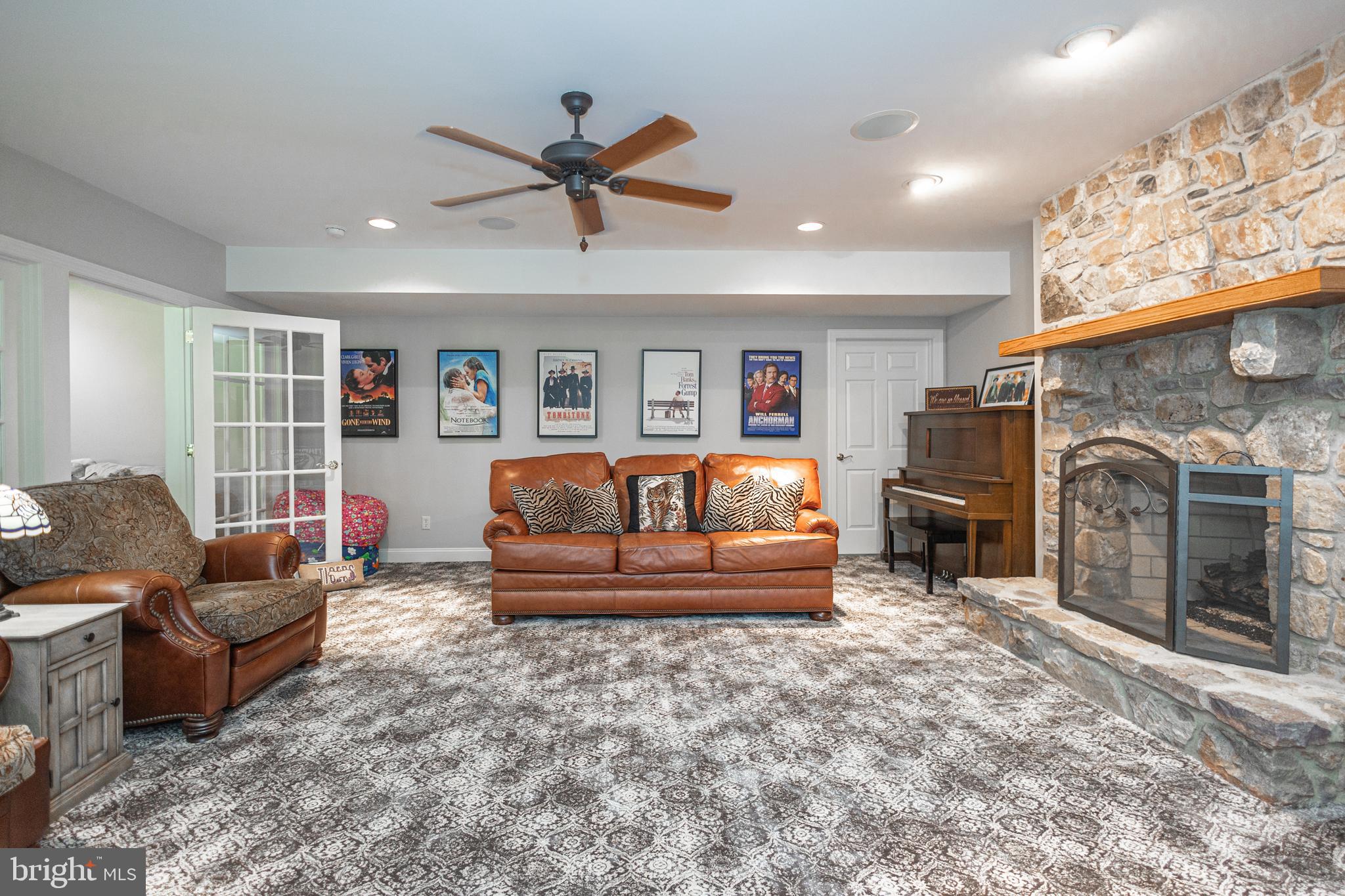 3380 Indian Springs Road Doylestown, PA 18902 - Photo 38 of 57 a living room with furniture a fireplace and a window