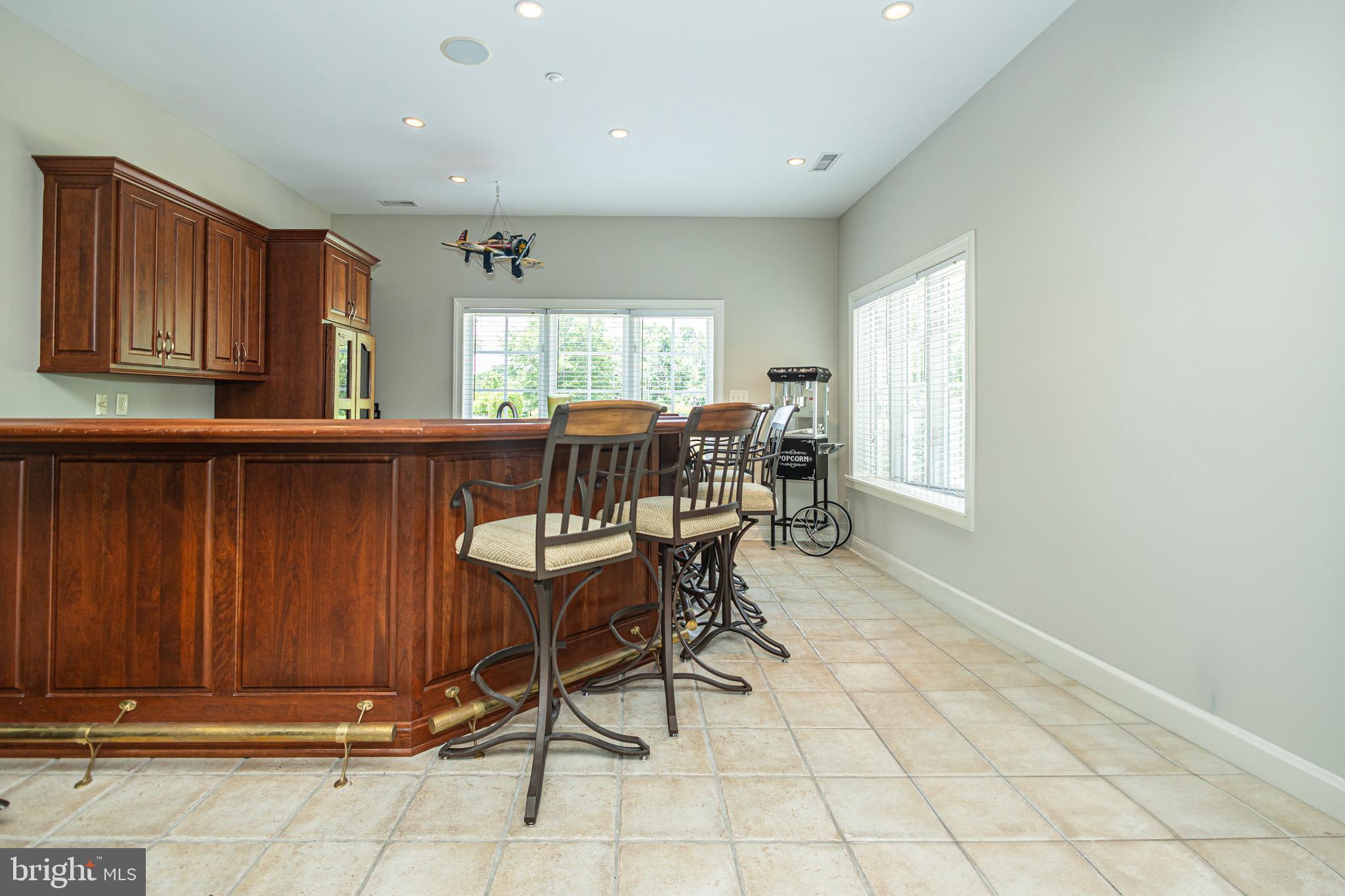 3380 Indian Springs Road Doylestown, PA 18902 - Photo 40 of 57 a view of a kitchen with dining area and windows
