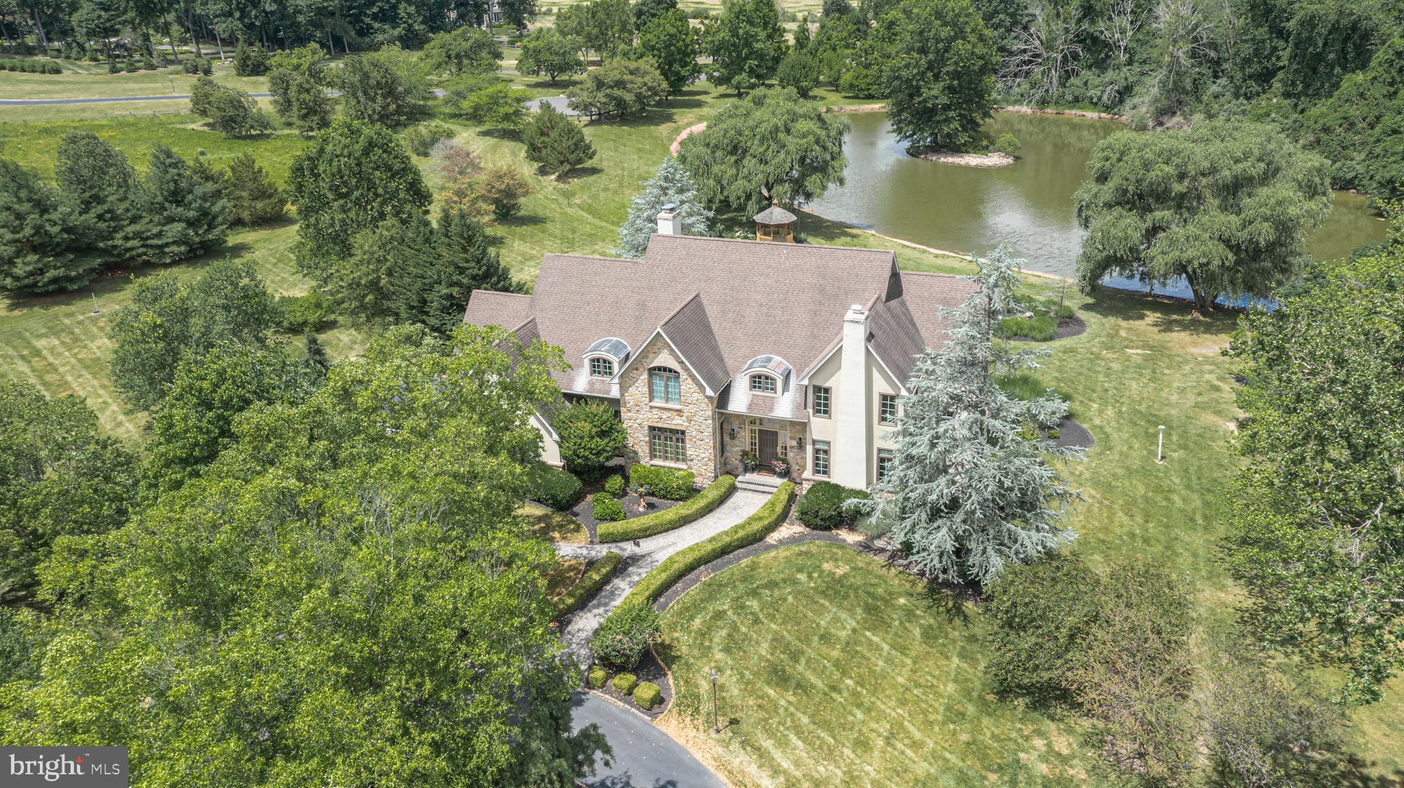 3380 Indian Springs Road Doylestown, PA 18902 - Photo 57 of 57 an aerial view of a house with a yard and lake view