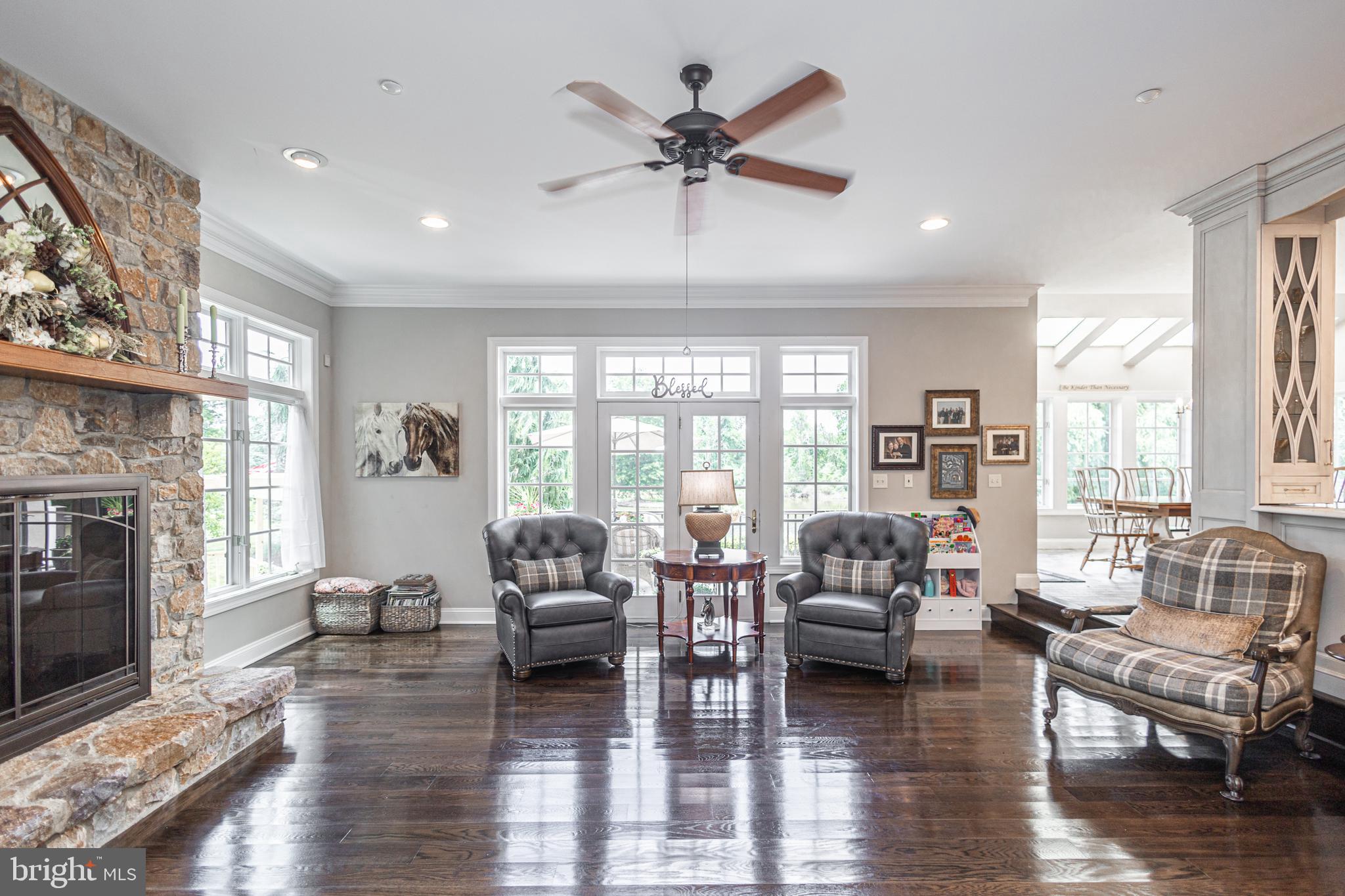 3380 Indian Springs Road Doylestown, PA 18902 - Photo 6 of 57 a living room with furniture fireplace and a large window