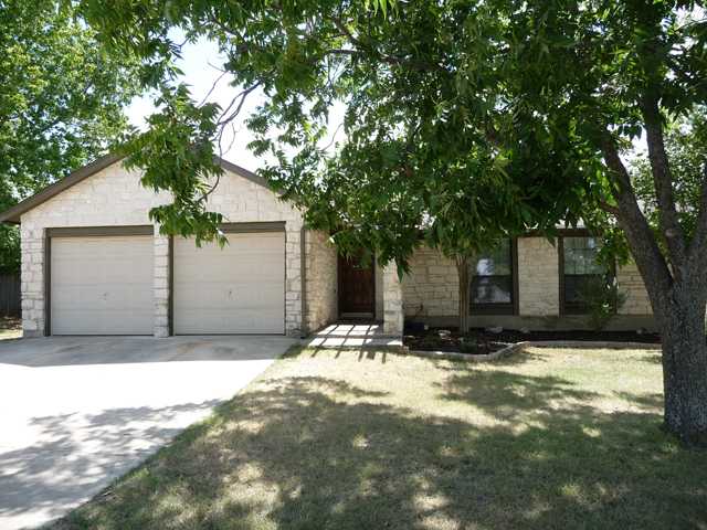 a house with yard in front of it