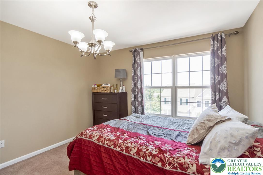 3566 Penfield Way Nazareth, PA 18064 - Photo 32 of 47 A naturally illuminated bedroom offers comfort and a tranquil escape.