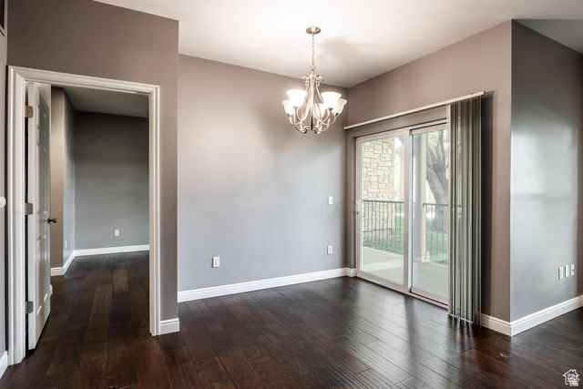 900 Bitner Road, Unit M 17 Park City, UT 84098 - Photo 9 of 29 Unfurnished dining area with suspended lighting and dark wood-type flooring