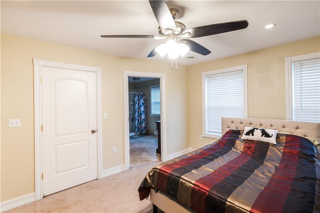 147 Heeter Road Knox, PA 16232 - Photo 18 of 40 a bedroom with a bed and a chandelier