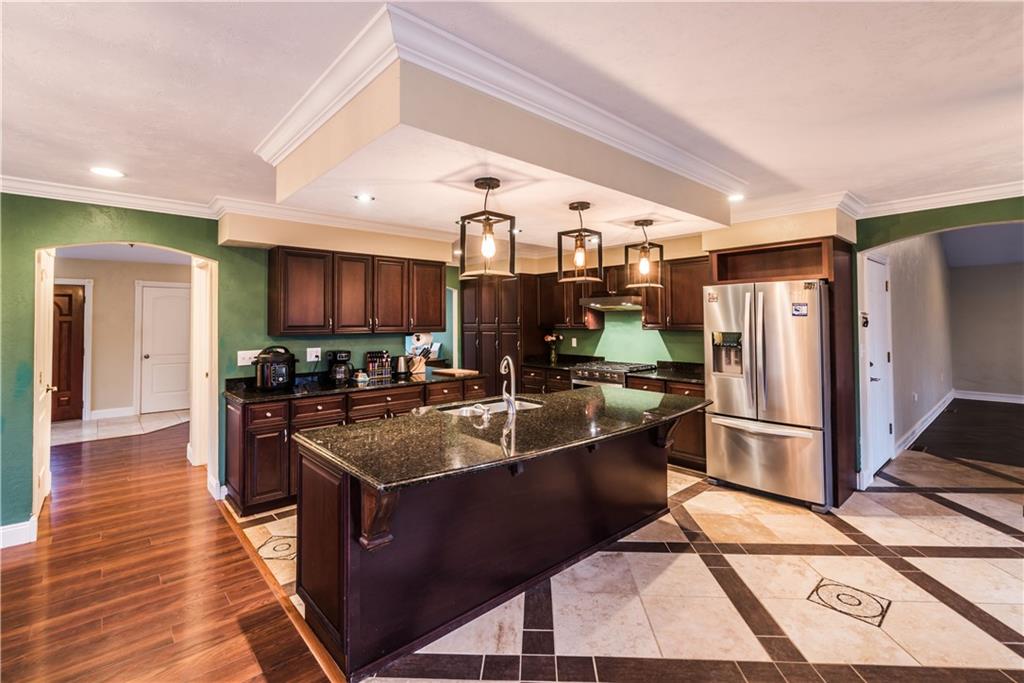 147 Heeter Road Knox, PA 16232 - Photo 4 of 40 a kitchen with stainless steel appliances granite countertop a sink stove and refrigerator