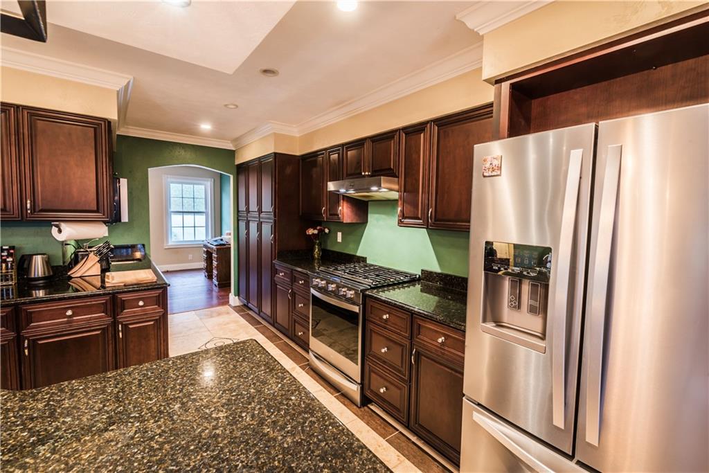 147 Heeter Road Knox, PA 16232 - Photo 5 of 40 a kitchen with stainless steel appliances granite countertop a refrigerator stove and sink