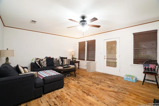 a living room with furniture and a window