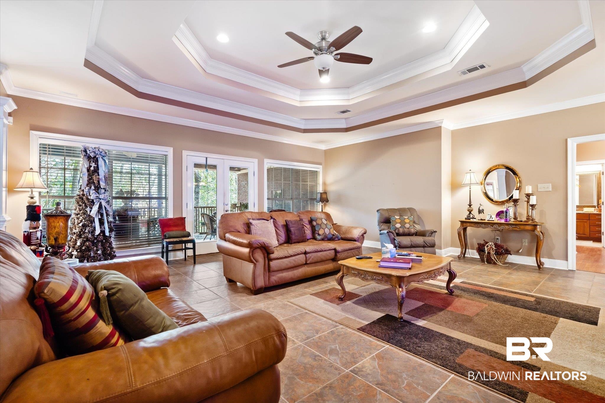 2400 Waterford Road Semmes, AL 36575 - Photo 7 of 30 Living area featuring a raised ceiling, ceiling fan, ornamental molding, and french doors