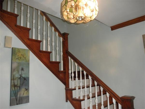 36 Jasper Street Saugus, MA 01906 - Photo 11 of 13 a view of staircase with wooden floor and a chandelier
