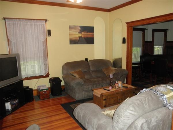36 Jasper Street Saugus, MA 01906 - Photo 6 of 13 a living room with furniture and a flat screen tv