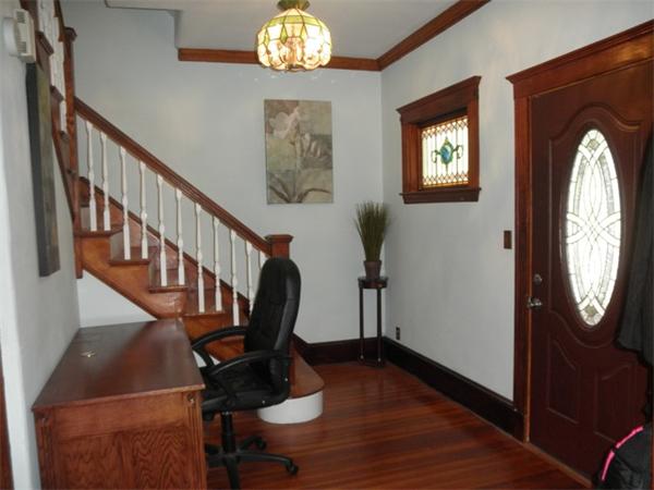 36 Jasper Street Saugus, MA 01906 - Photo 10 of 13 a view of a hallway with wooden floor and windows