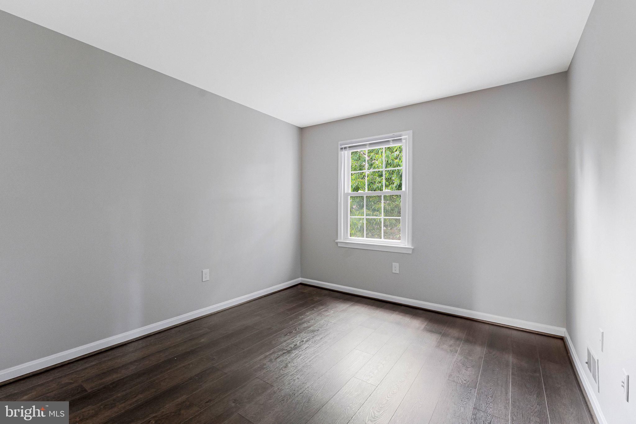 2000 Gallows Tree Lane Vienna, VA 22182 - Photo 34 of 58 an empty room with wooden floor and windows
