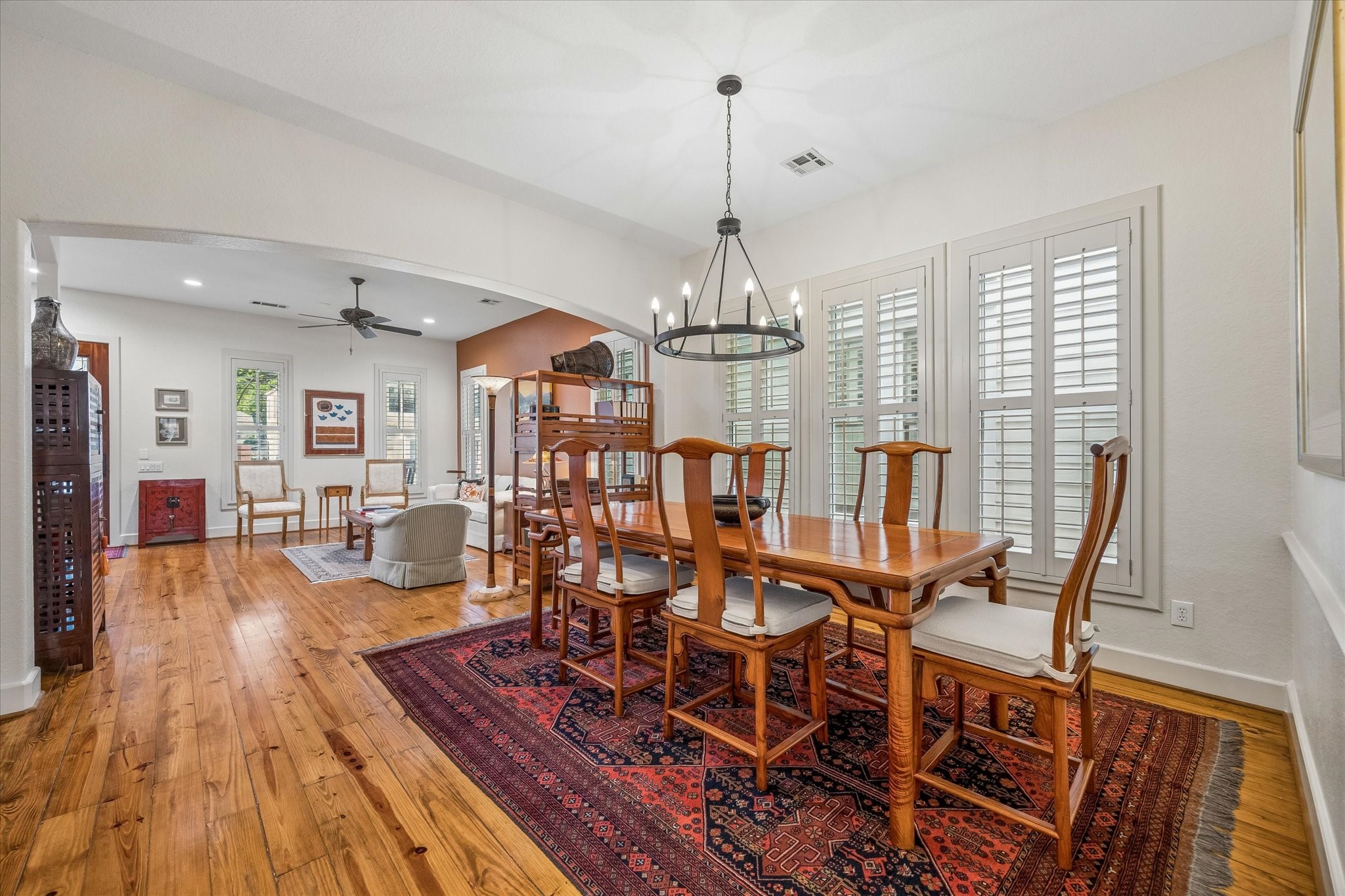 706 East 12th Street Houston, TX 77008 - Photo 13 of 34 a view of a dining room with furniture wooden floor and chandelier