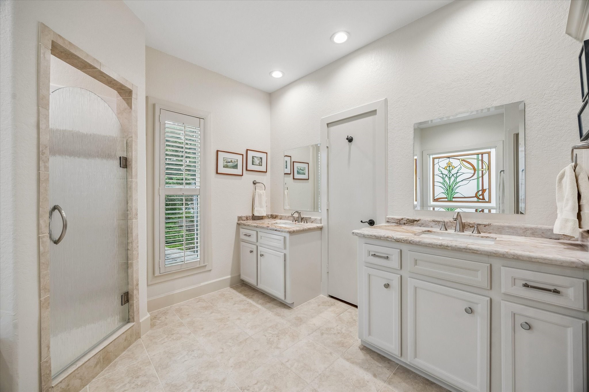 706 East 12th Street Houston, TX 77008 - Photo 23 of 34 a bathroom with a granite countertop sink mirror bathtub and shower