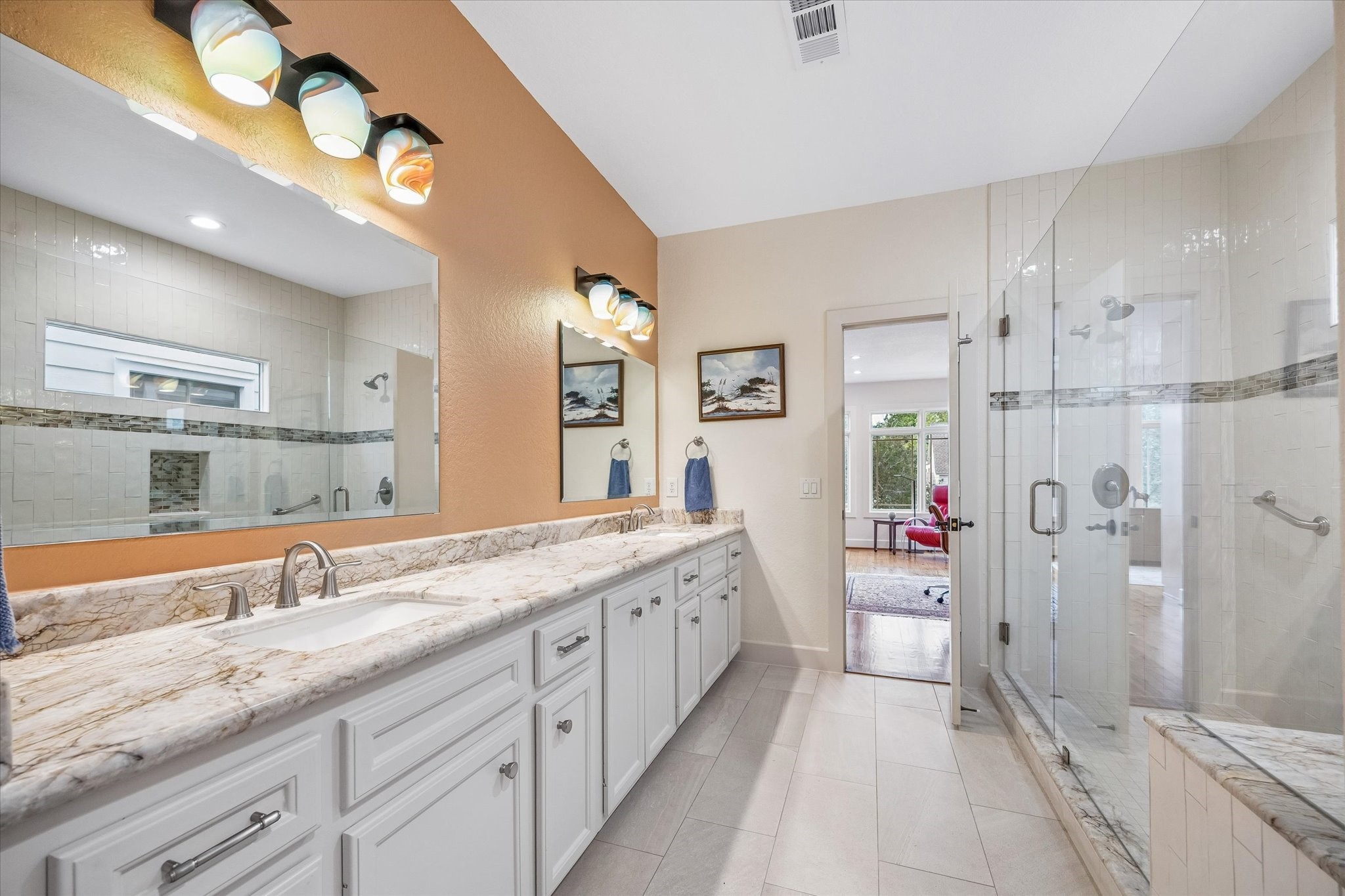 706 East 12th Street Houston, TX 77008 - Photo 26 of 34 a spacious bathroom with a granite countertop sink mirror and shower