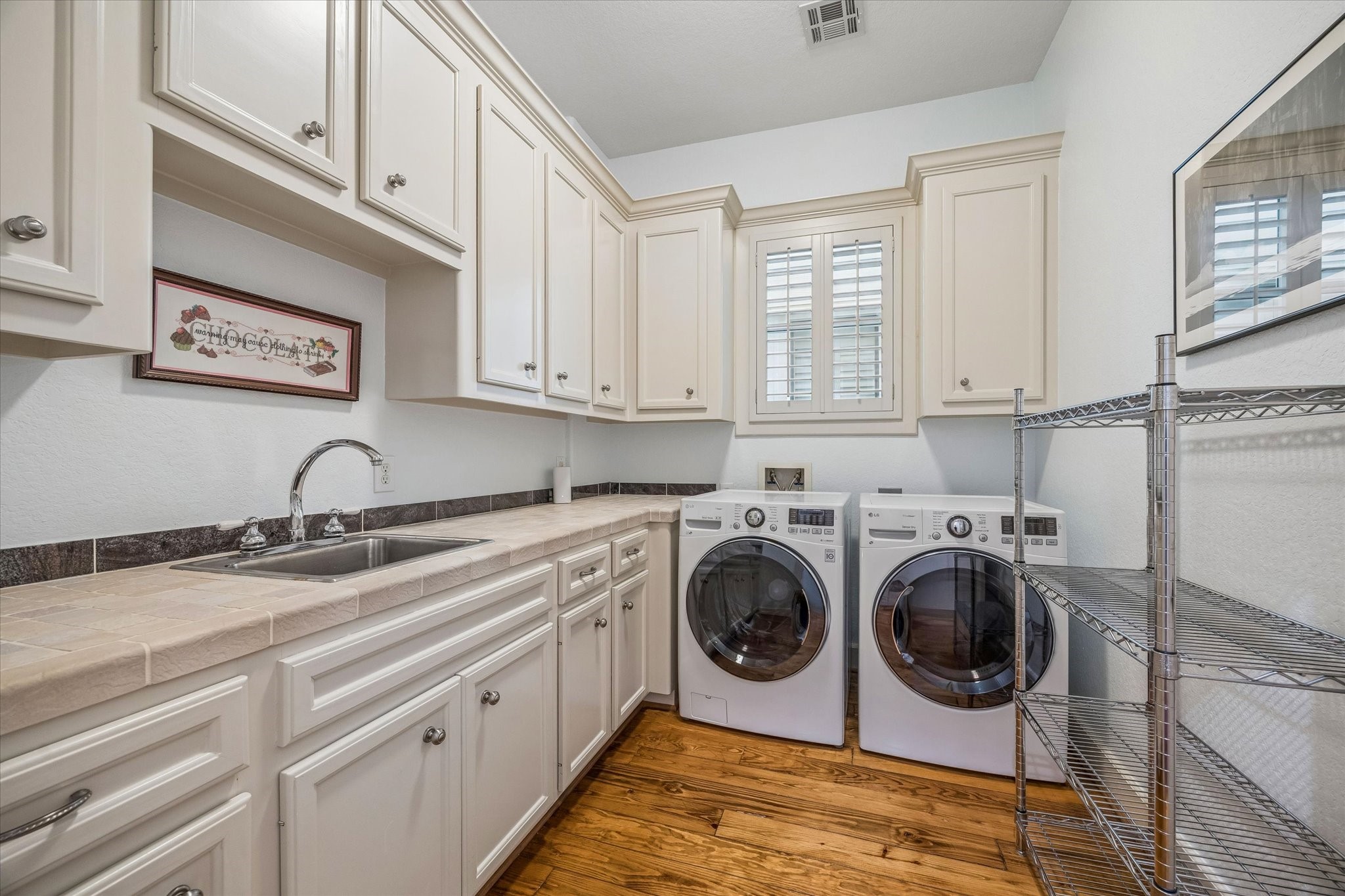 706 East 12th Street Houston, TX 77008 - Photo 28 of 34 a utility room with sink dryer and washer