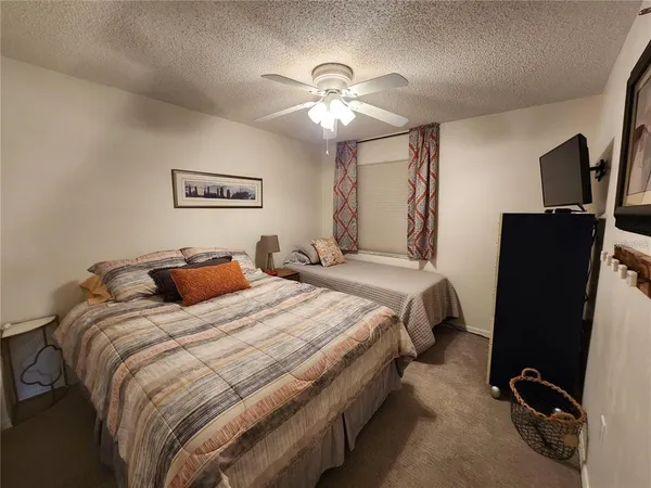 a bedroom with bed and window