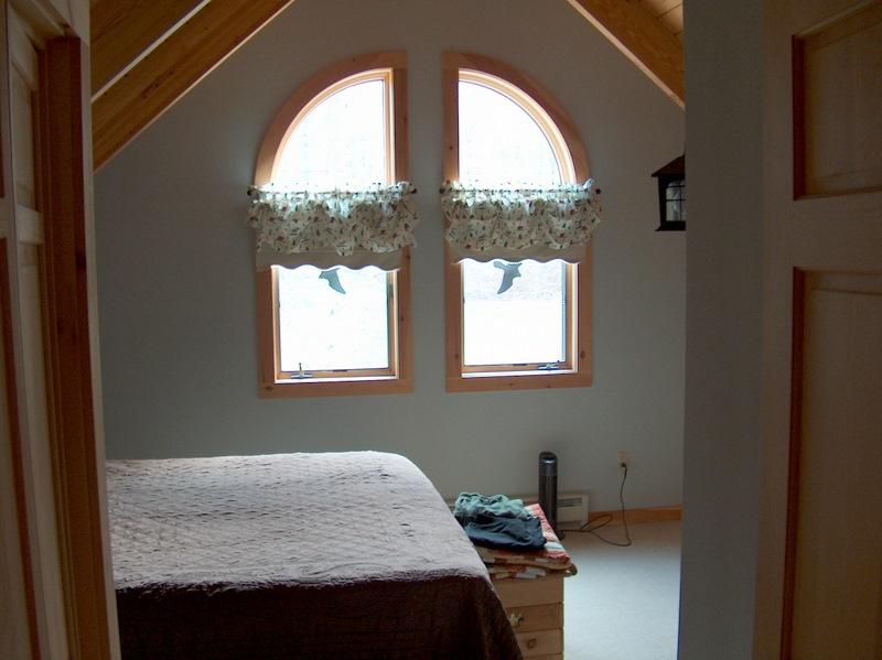 999 E Road Stamford, VT 05352 - Photo 11 of 14 a bedroom with a bed and a window