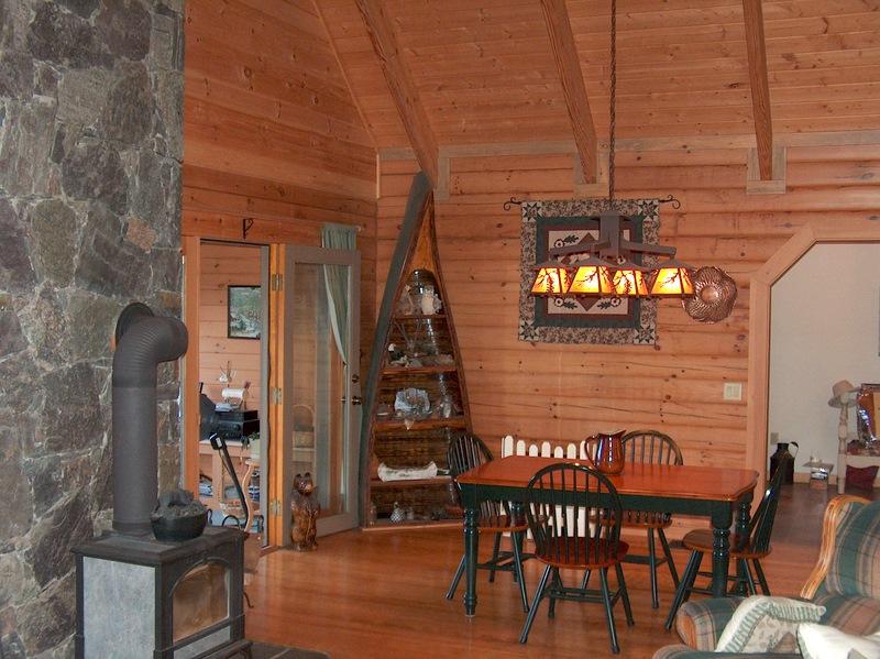 999 E Road Stamford, VT 05352 - Photo 8 of 14 a view of a dining room with furniture and wooden floor