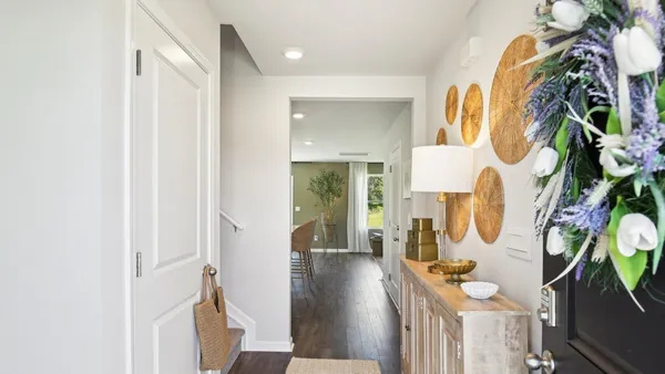 a view of an entryway with wooden floor