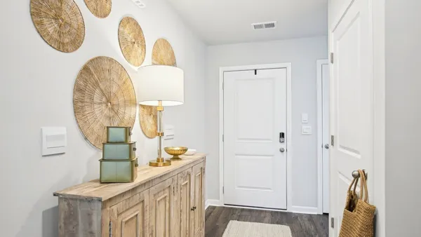 a view of a entryway door with wooden floor