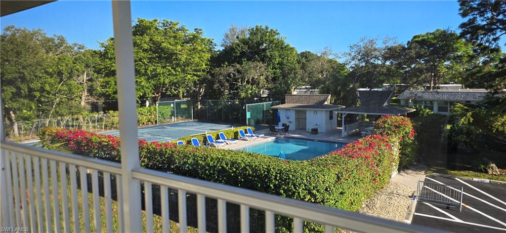 115 Georgetown Boulevard, Unit 115 Naples, FL 34112 - Photo 14 of 32 a view of a balcony with chairs