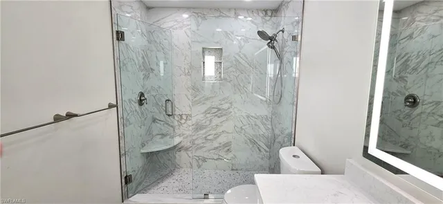 a bathroom with a sink vanity and a mirror