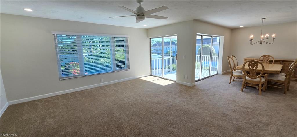 115 Georgetown Boulevard, Unit 115 Naples, FL 34112 - Photo 3 of 32 a view of livingroom with furniture and windows