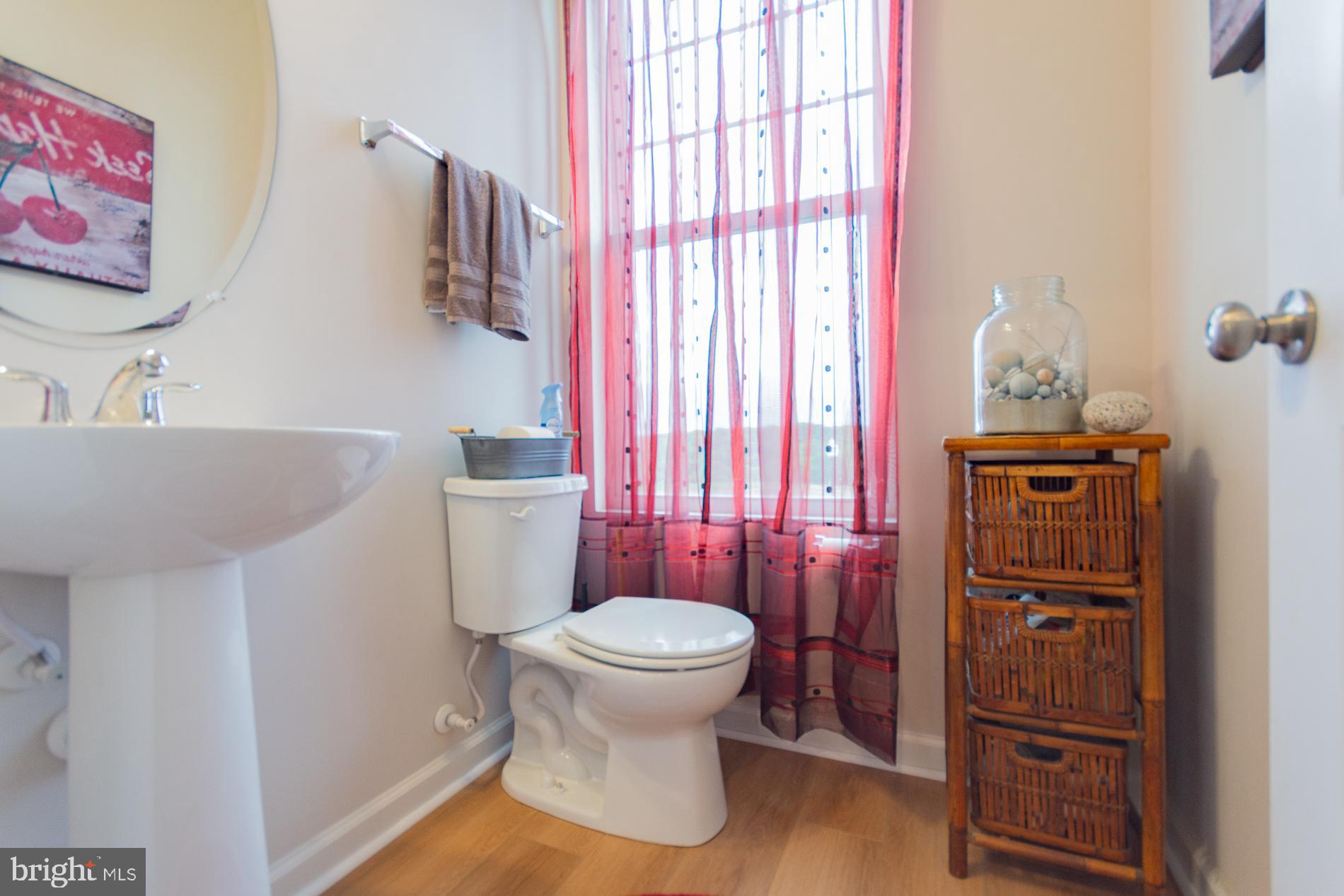 219 Presidents Pointe Avenue Ranson, WV 25438 - Photo 25 of 41 a bathroom with a toilet and a sink