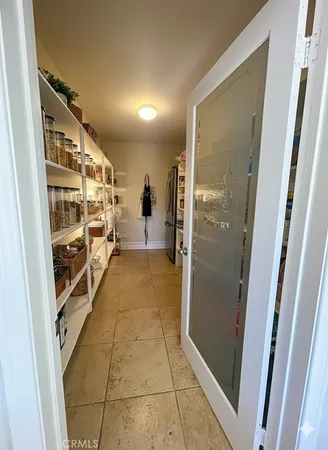 a view of a kitchen from the hallway