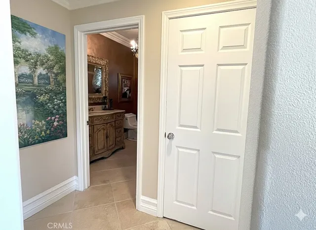 a spacious bathroom with a granite countertop toilet a sink and a mirror