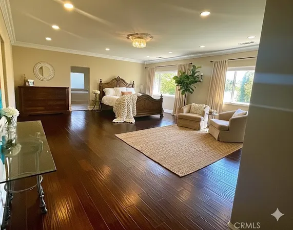 a room with a large window and a wooden floor