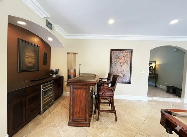 a kitchen with granite countertop a sink cabinets and stainless steel appliances