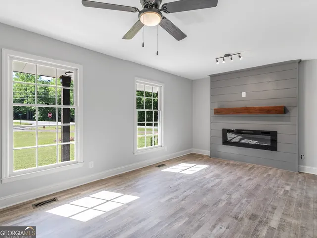 a view of a kitchen with a sink and cabinet