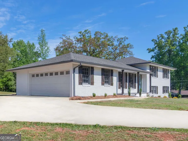 a house with trees in the background