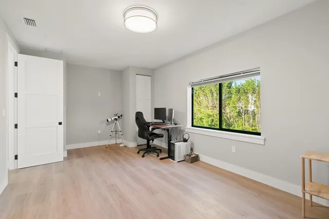 a workspace with furniture and a window