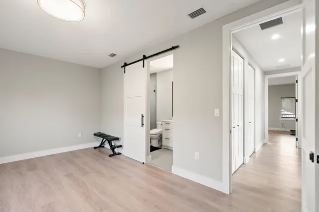 a view of a room with a furniture and closet area