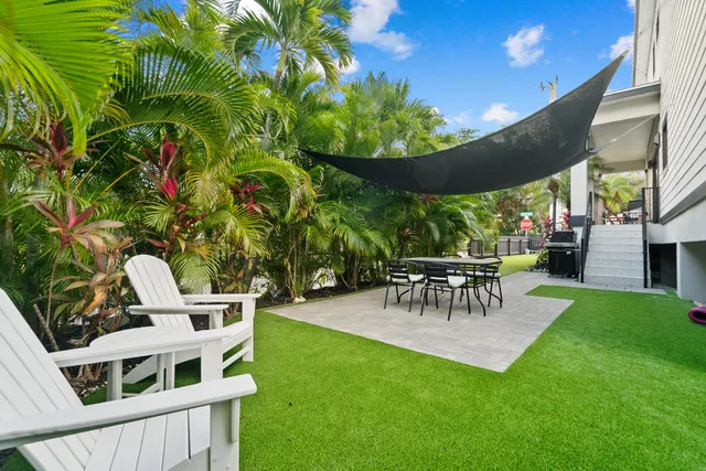 a view of an chairs and table in the patio