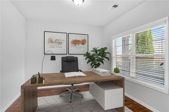 a view of a workspace with furniture