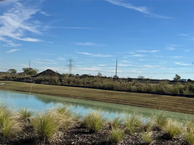 a view of lake and green space