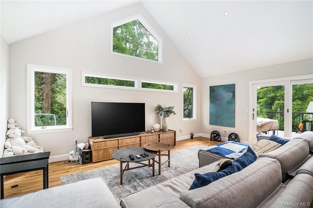 4 Parkfield Road Scarsdale, NY 10583 - Photo 8 of 33 Enjoy the inviting family room off the kitchen with glass sliders to new deck.