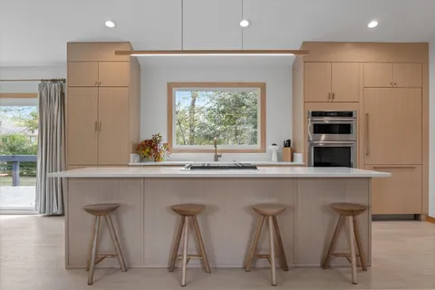 a view of a bathroom with tub and window