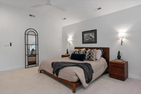 a bathroom with a shower sink and mirror