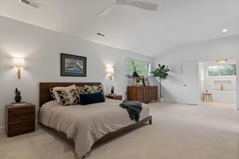 a bathroom with a sink a mirror and vanity