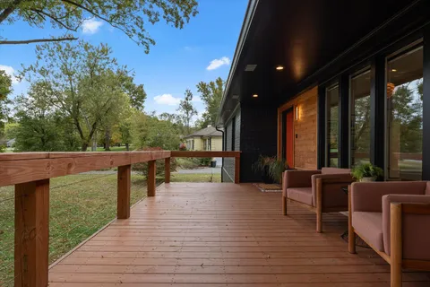 a view of a patio with wooden floor